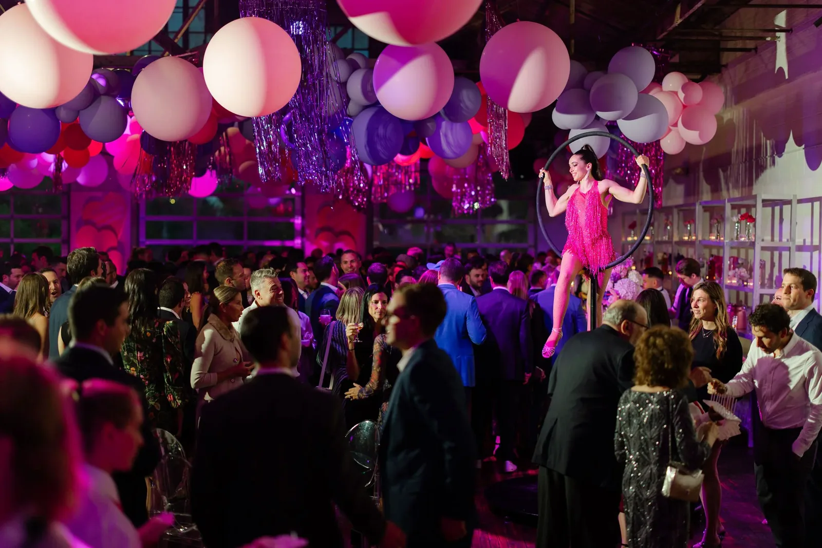 Fundraiser gala in the Boathouse with an aerial performer and balloon decor
