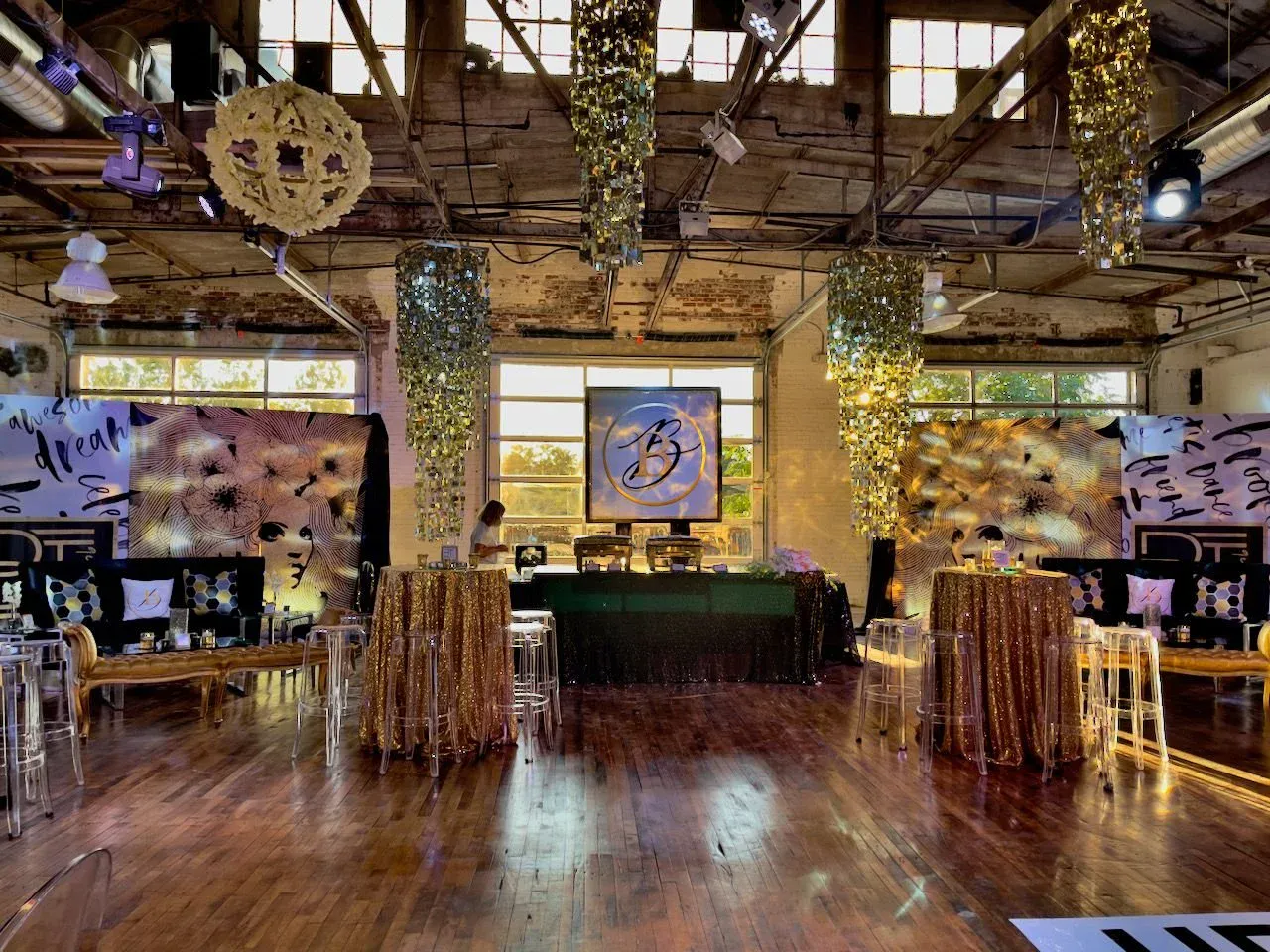 Teen party lounge with gold sequin cocktail tables and sunset light through factory windows